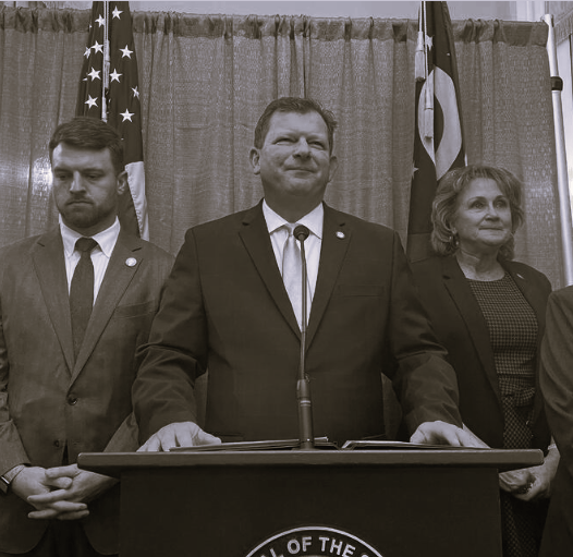 Ohio House Speaker Jason Stephens stands with fellow Republicans at an Ohio Statehouse press conference.
